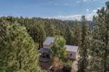 Nestled amidst a lush forest, this stunning property offers a serene escape.