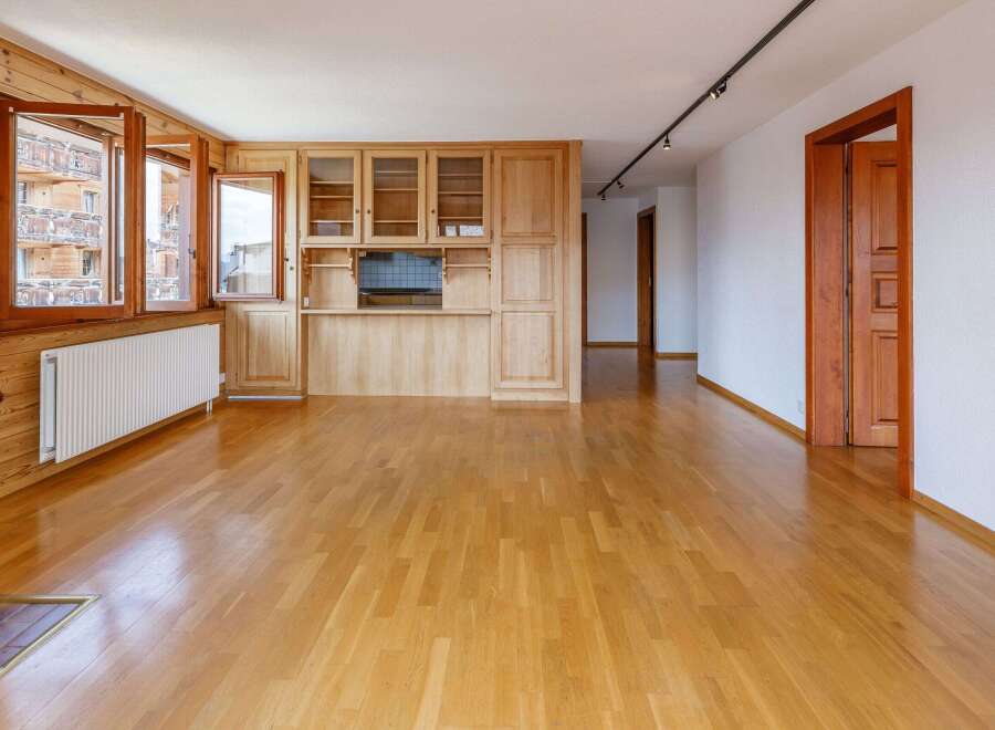 This stunning property boasts a warm and inviting interior with beautiful wooden floors and paneling throughout.