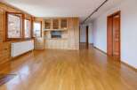 This stunning property boasts a warm and inviting interior with beautiful wooden floors and paneling throughout.