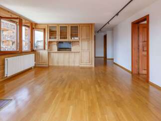 This stunning property boasts a warm and inviting interior with beautiful wooden floors and paneling throughout.