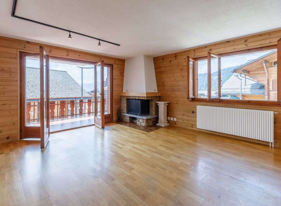 This stunning property boasts a warm and inviting interior with beautiful wooden accents throughout.