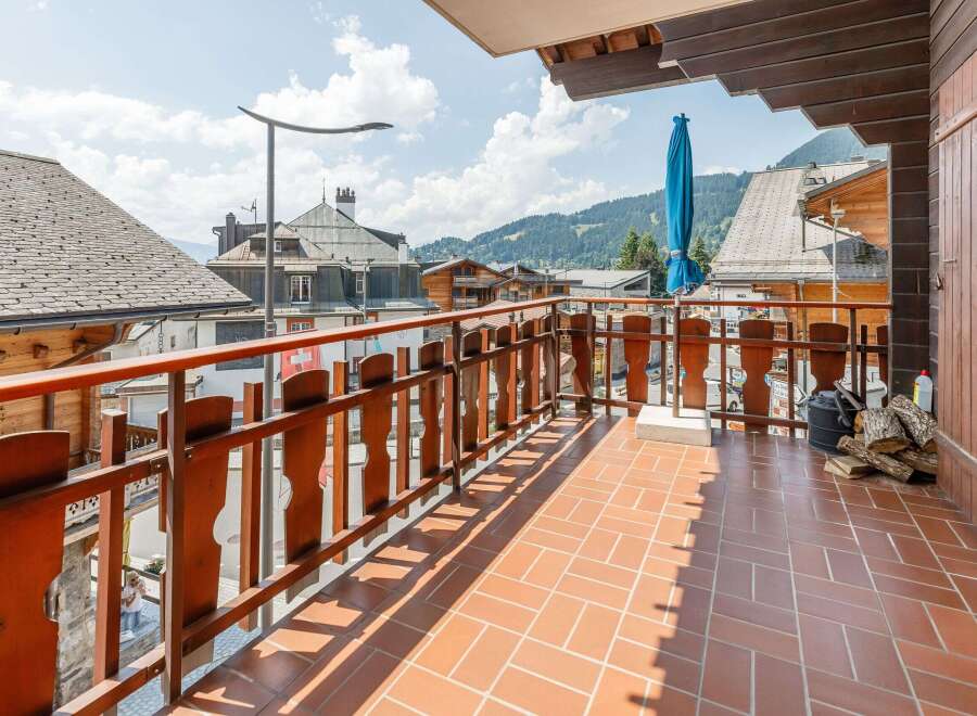 Enjoy breathtaking mountain views from this charming balcony.