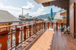 Enjoy breathtaking mountain views from this charming balcony.
