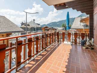 Enjoy breathtaking mountain views from this charming balcony.