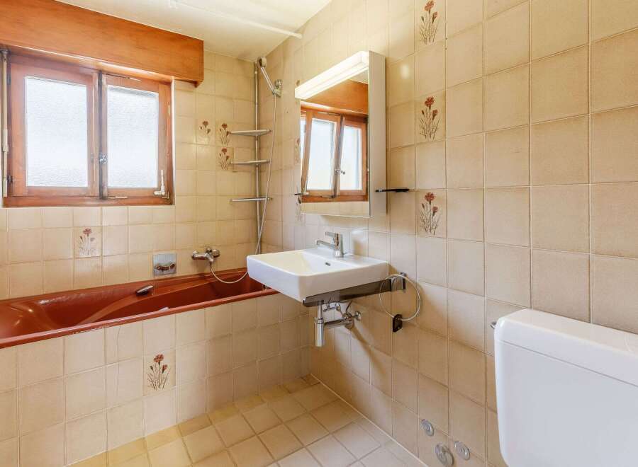 This bathroom features a unique design with a vintage aesthetic.