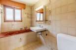 This bathroom features a unique design with a vintage aesthetic.