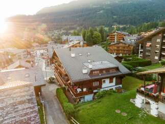 Nestled in a picturesque mountain village, this stunning property boasts traditional chalet architecture with a modern touch.