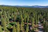 Nestled amidst a lush forest, this property offers a serene escape with modern homes seamlessly blending with nature.