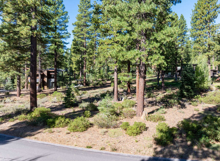 Nestled amidst a lush forest, this property offers a serene escape with mature trees and natural beauty.