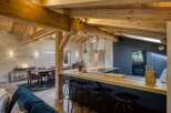 This stunning property boasts a rustic yet modern kitchen, perfect for culinary enthusiasts.