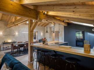 This stunning property boasts a rustic yet modern kitchen, perfect for culinary enthusiasts.