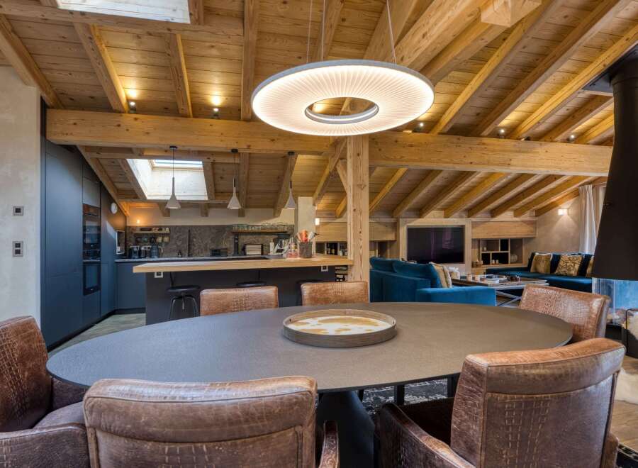 Experience luxury living in this stunning property, featuring a spacious dining area perfect for entertaining.