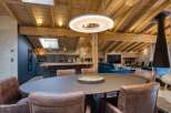 Experience luxury living in this stunning property, featuring a spacious dining area perfect for entertaining.