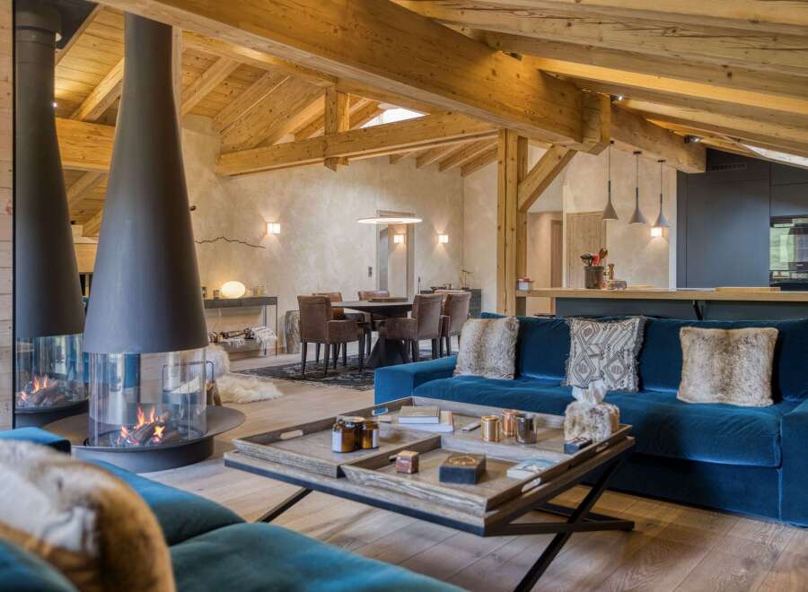 Experience luxury living in this stunning property featuring a cozy living room with a modern fireplace.