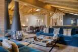 Experience luxury living in this stunning property featuring a cozy living room with a modern fireplace.