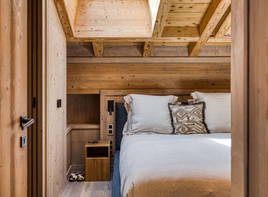 Step into a cozy bedroom retreat, where rustic charm meets modern comfort.