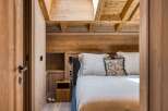 Step into a cozy bedroom retreat, where rustic charm meets modern comfort.