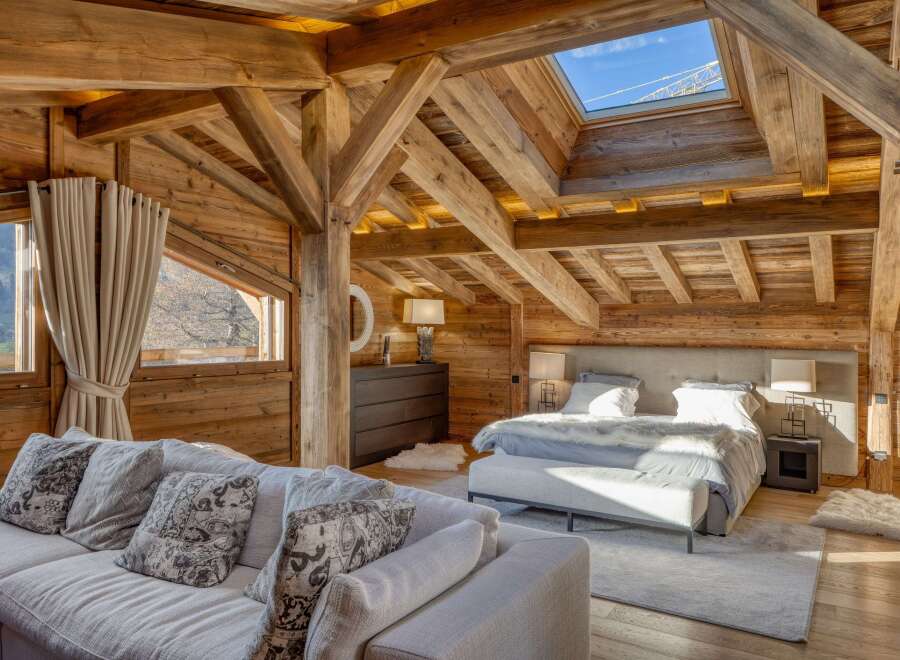 Experience the epitome of rustic luxury in this stunning chalet bedroom.