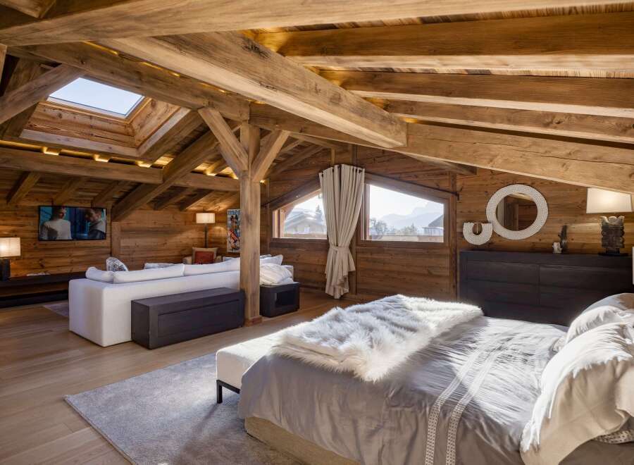 Experience the epitome of rustic luxury in this stunning chalet-style bedroom.