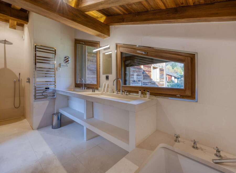 This luxurious bathroom boasts a modern design with natural elements.