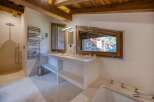 This luxurious bathroom boasts a modern design with natural elements.