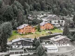 Nestled in a serene, tree-lined landscape, this property offers a unique blend of natural beauty and modern living.