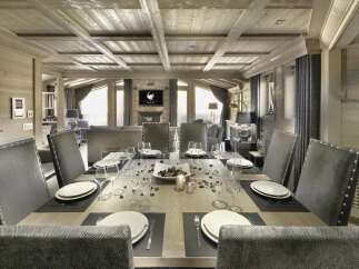 Experience luxury living in this stunning property, featuring a beautifully designed dining area.