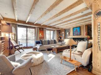 Experience the epitome of rustic luxury in this stunning living room.