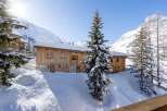 Discover a stunning chalet nestled in a picturesque winter wonderland.