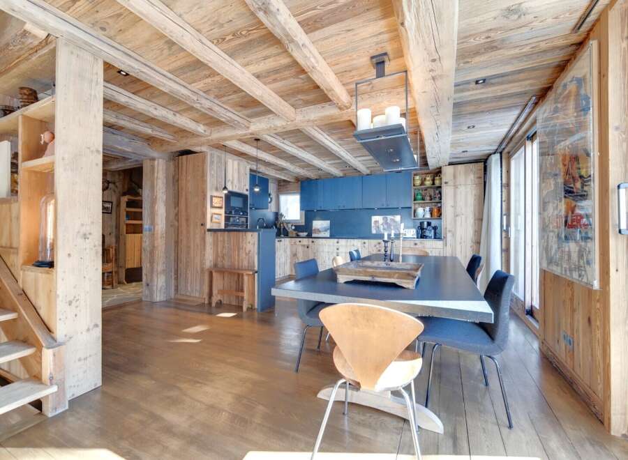 Experience rustic elegance in this stunning property, featuring a warm wooden interior and exposed beams.