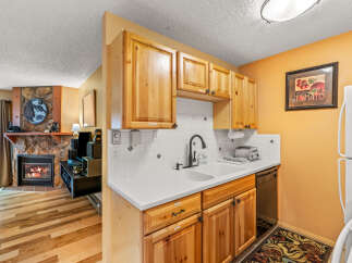 Discover the charm of this cozy kitchen, perfect for preparing delicious meals.