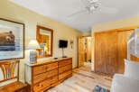 This cozy bedroom features a rustic wooden dresser with ample storage, perfect for organizing belongings.