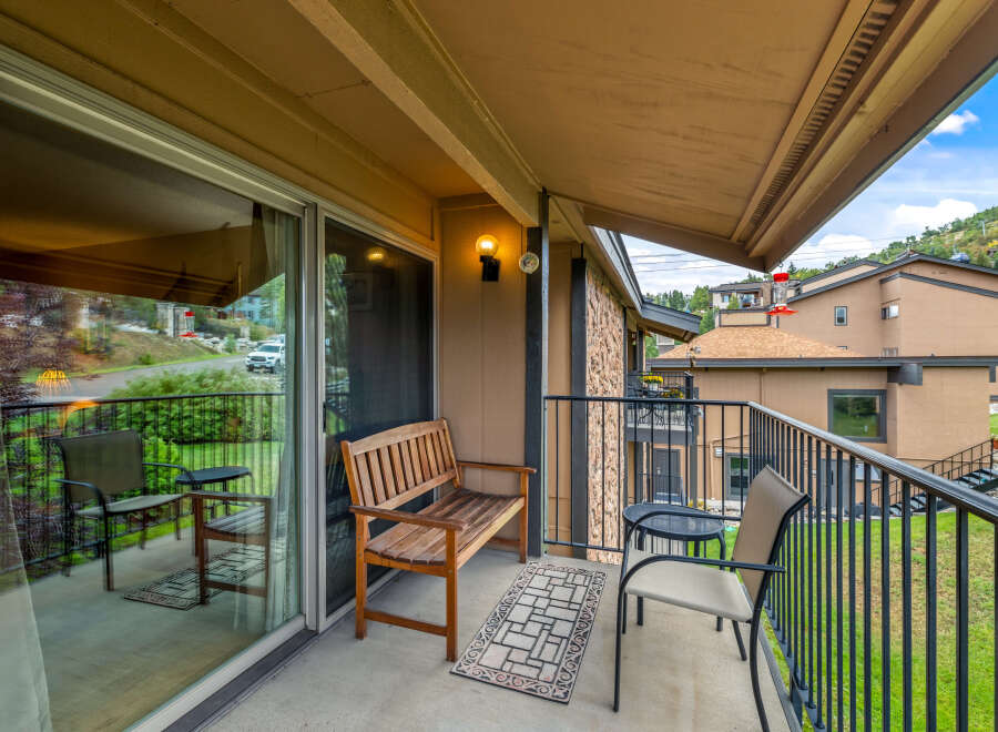 Enjoy the serene views from this charming balcony.