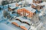 Discover a stunning alpine property nestled in a picturesque winter wonderland.
