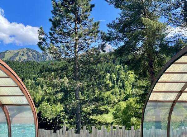 Escape to your own private oasis with this stunning property! Enjoy the crystal-clear pool surrounded by lush greenery and breathtaking mountain views.