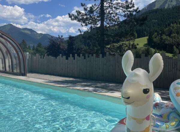 Enjoy a refreshing dip in this stunning outdoor pool, surrounded by breathtaking mountain views.