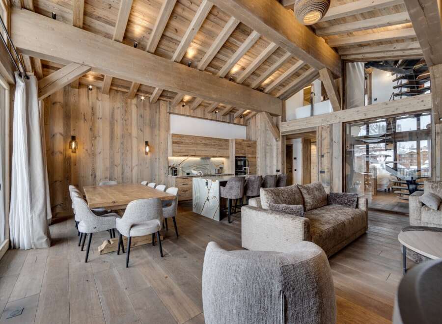 Experience luxury living in this stunning chalet, showcasing exquisite wooden architecture and a warm, inviting atmosphere.
