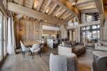 Experience luxury living in this stunning chalet, showcasing exquisite wooden architecture and a warm, inviting atmosphere.