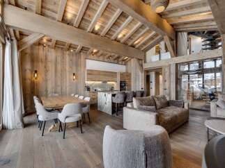 Experience luxury living in this stunning chalet, showcasing exquisite wooden architecture and a warm, inviting atmosphere.