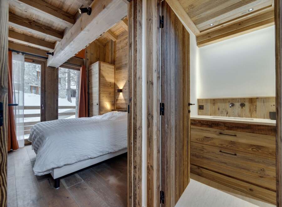 Step into a cozy retreat with this stunning property, featuring exquisite wooden accents throughout.