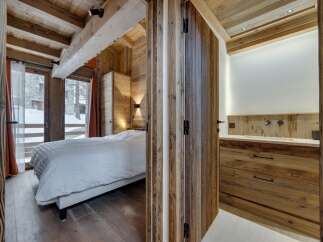 Step into a cozy retreat with this stunning property, featuring exquisite wooden accents throughout.