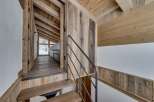 This stunning property showcases a rustic interior with beautiful wooden accents.