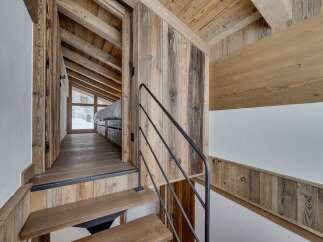 This stunning property showcases a rustic interior with beautiful wooden accents.