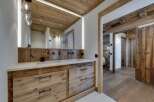 This stunning bathroom showcases rustic elegance with its wooden accents and modern design.
