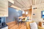 This stunning property boasts a warm and inviting dining area, perfect for hosting gatherings.