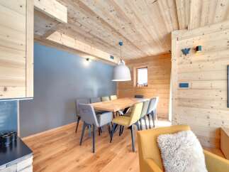 This stunning property boasts a warm and inviting dining area, perfect for hosting gatherings.