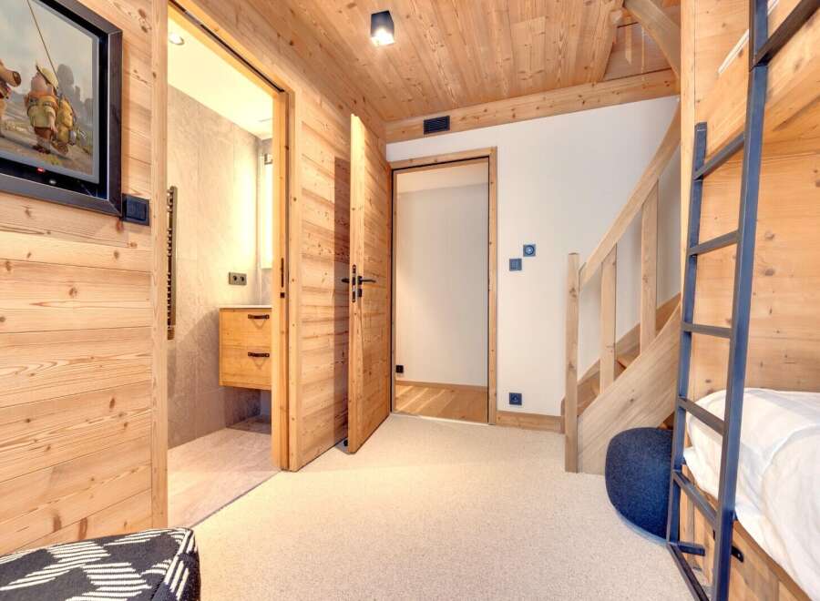 This charming property boasts a cozy interior with wooden accents throughout, creating a warm and inviting atmosphere.