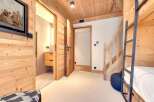 This charming property boasts a cozy interior with wooden accents throughout, creating a warm and inviting atmosphere.