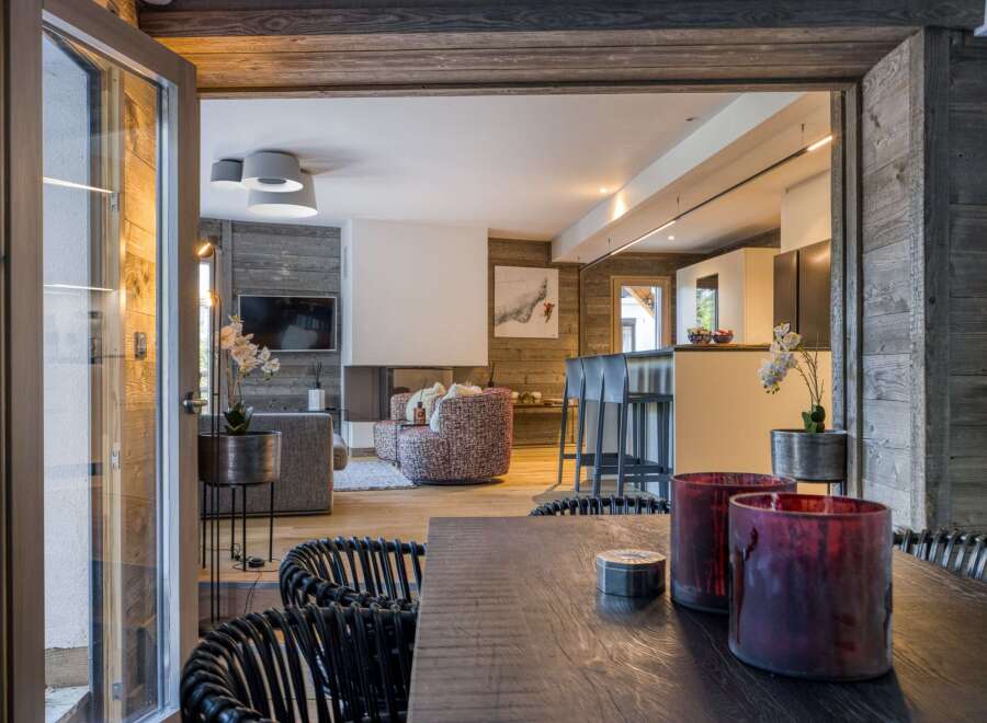 Experience luxury living in this stunning chalet, featuring a seamless blend of modern design and rustic charm.