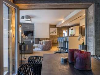 Experience luxury living in this stunning chalet, featuring a seamless blend of modern design and rustic charm.